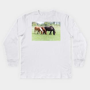 Three horses grazing on pasture Kids Long Sleeve T-Shirt